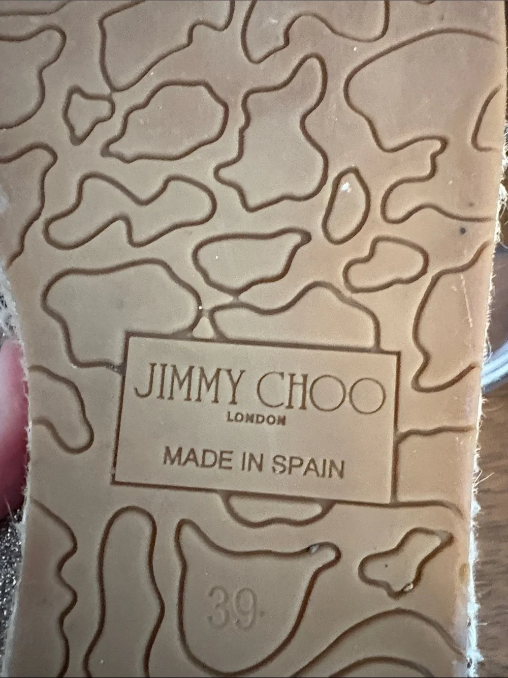 Jimmy Choo can brass back